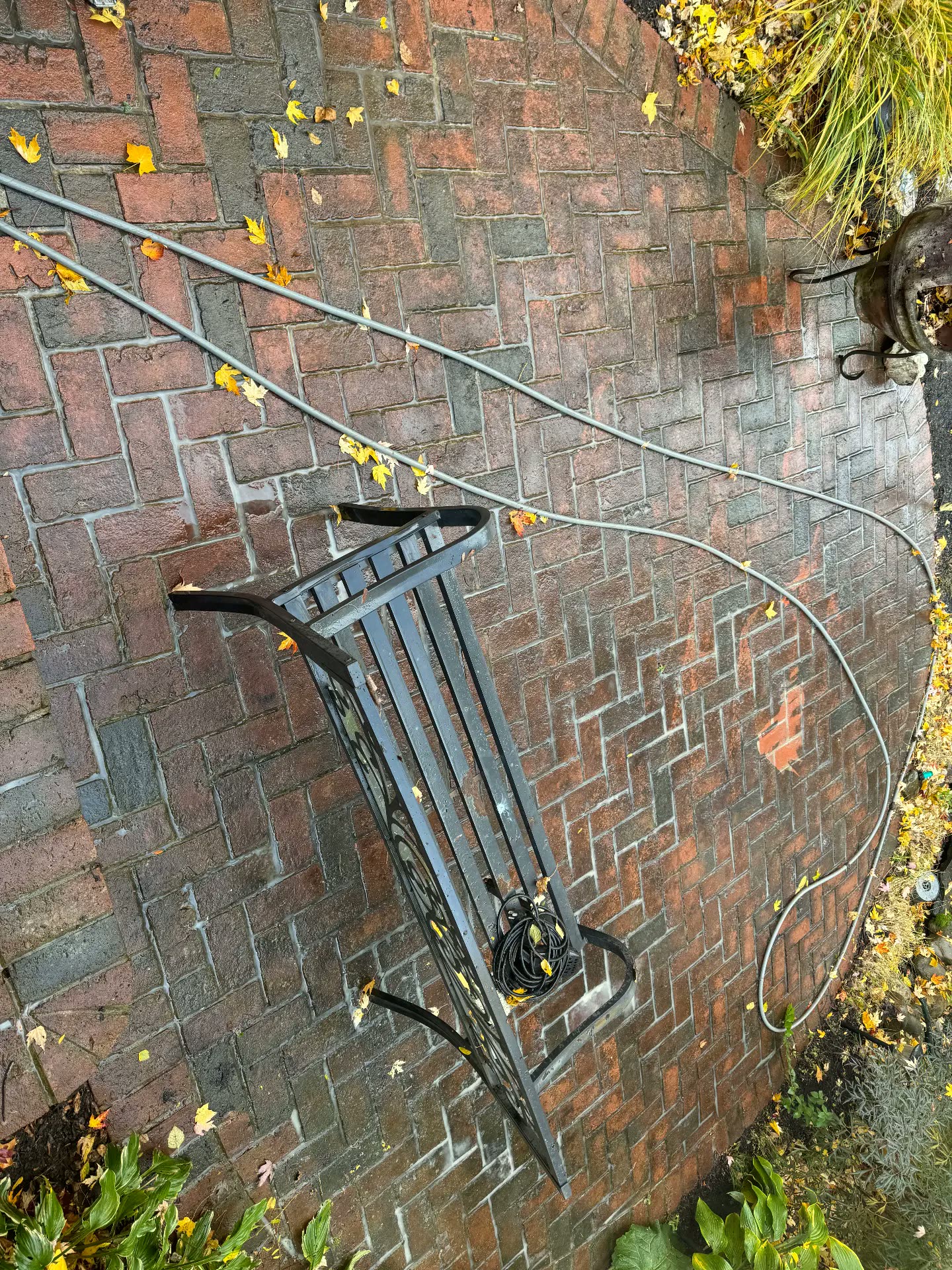 Brick paver patio dulled with dirt and leaves before cleaning