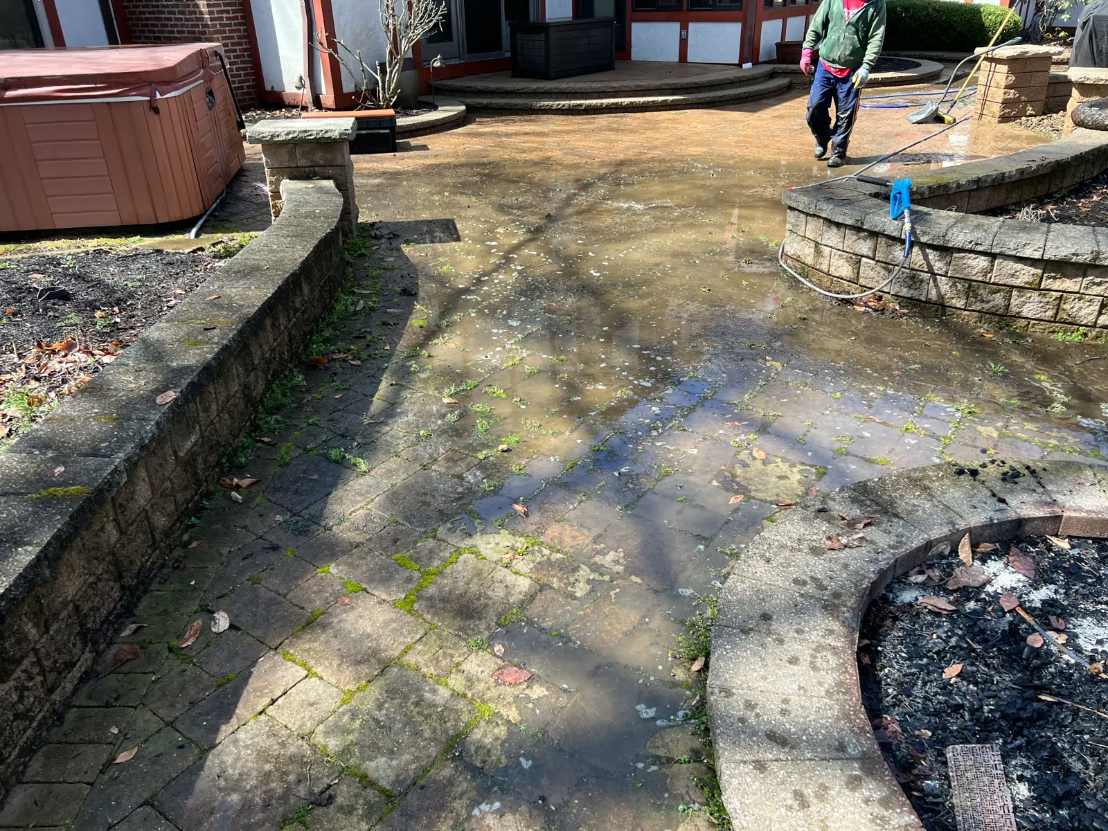 Paver patio being washed on the job