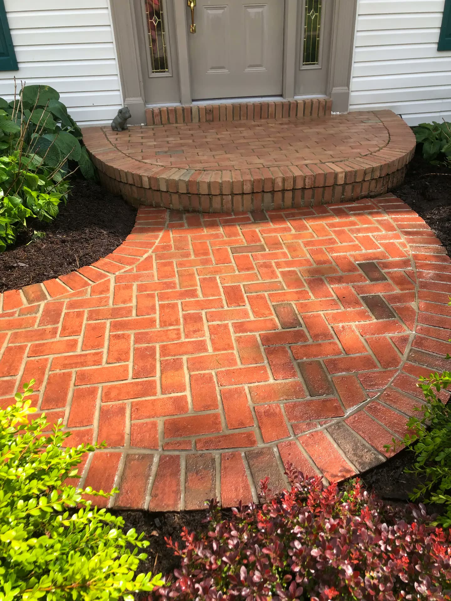Bright red brick entry after cleaning