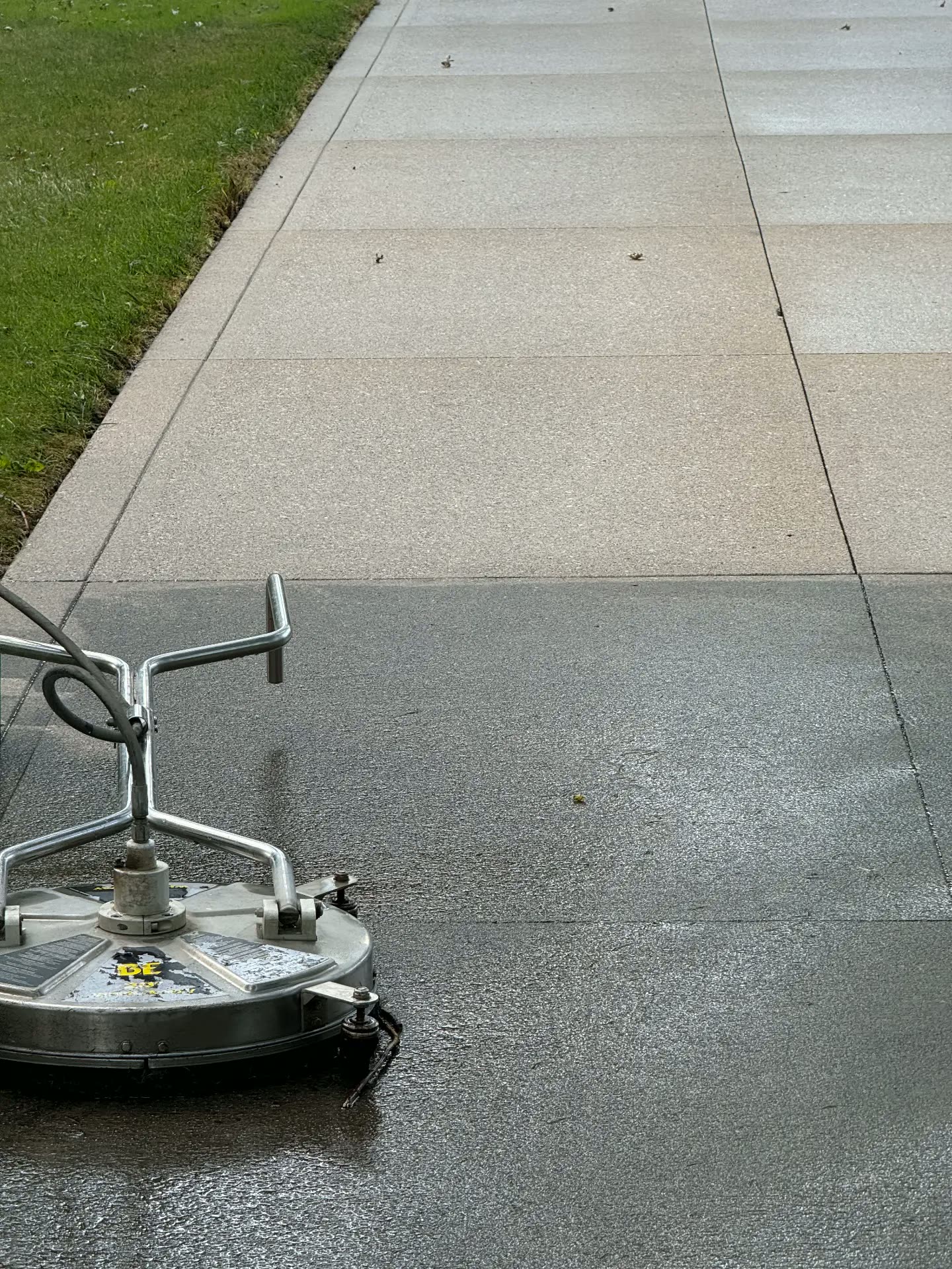 Clean concrete driveway after surface cleaning